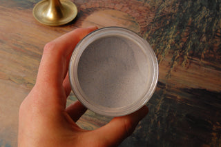 Close-up image of blue spirulina lemonade flavored powder.
