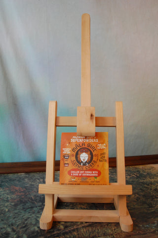 Mala Girl Cosmic Curry individual serving packet shown on a small easel.